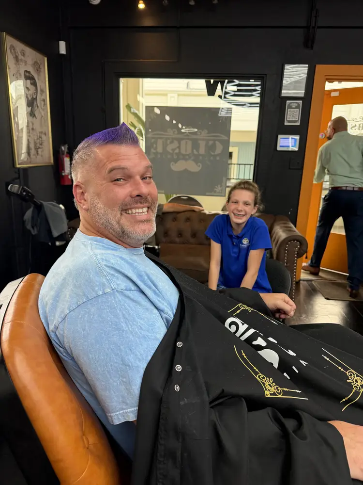 Happy client with a purple spiked style