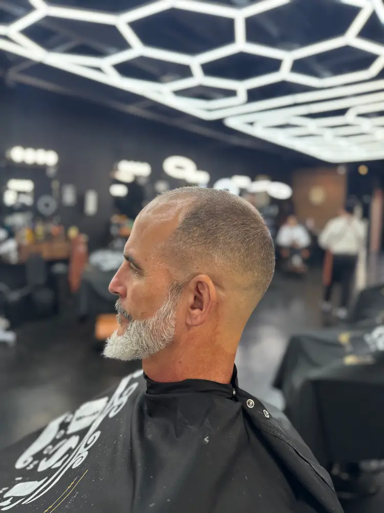 Short taper with a groomed gray beard